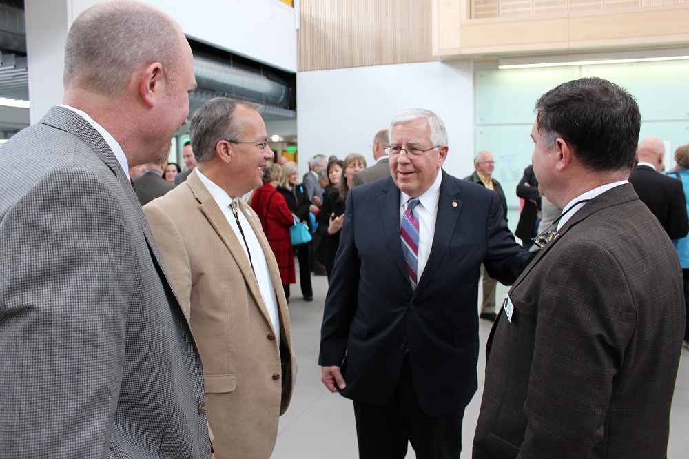 UW Enzi STEM Bldg-Senator Enzi visits with WDE's Brent Bacon, Rob Bryant, and Brent Young