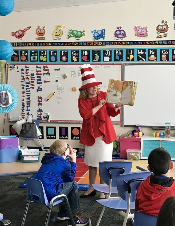 State Superintendent Jillian Balow reads a Dr. Seuss book aloud to students in a classroom