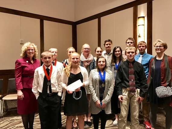 State Superintendent Jillian Balow poses with Wheatland Middle School students and their teacher at the University of Wyoming for History Day,