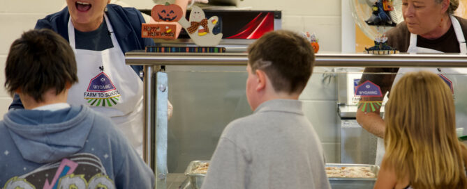 First Lady Jennie Gordon serves students at Douglas Upper Elementary as part of the Wyoming Farm to School Day celebrations.