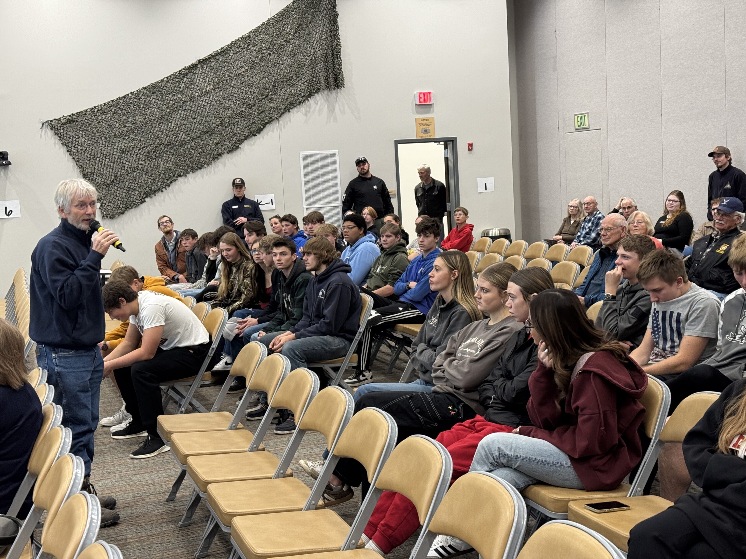 Dan Starks, founder of the National Museum of Military Vehicles, speaks.